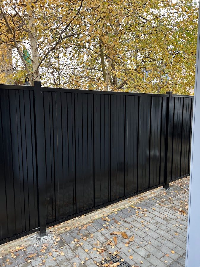 Recently built wooden fence with modern posts